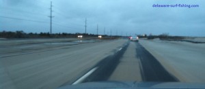 Route 1 covered in windblown and rain washed sand route 1, sand dune, blown dunes, blown sand, coastal highway