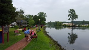 Kids fishing the park with their parents