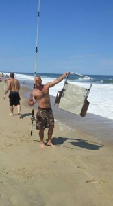 strange catches, beach chair inthe surf, delaware, sussex county, delmarva