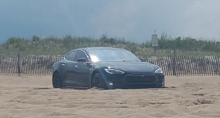 tesla, car stuckon beach,cape henlopen state park,