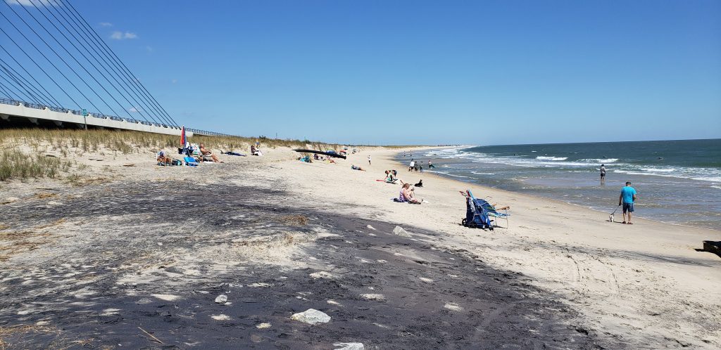 Indian River Inlet, north side beach, surfing beach, charles w cullen bridge, inlet bridge, coast guard station tower base, beach erosion, sand relocation pipe,