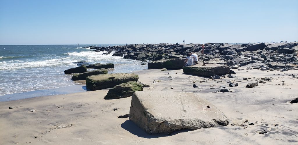 Indian River Inlet, north side beach, surfing beach, charles w cullen bridge, inlet bridge, coast guard station tower base, beach erosion, sand relocation pipe,