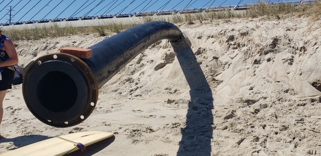 Indian River Inlet, north side beach, surfing beach, charles w cullen bridge, inlet bridge, coast guard station tower base, beach erosion, sand relocation pipe,
